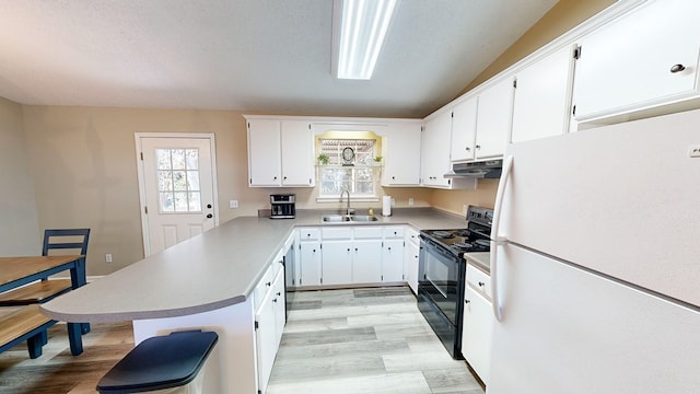 kitchen with black electric range, white refrigerator, kitchen peninsula, white cabinets, and light wood-type flooring