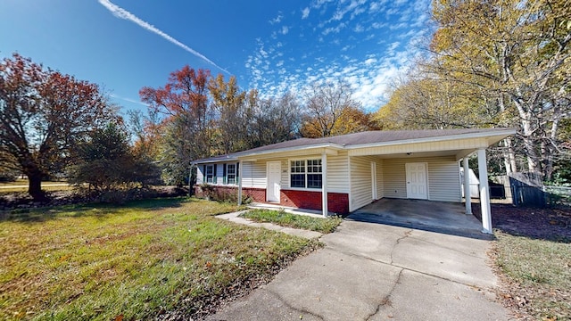 single story home with a front yard and a carport