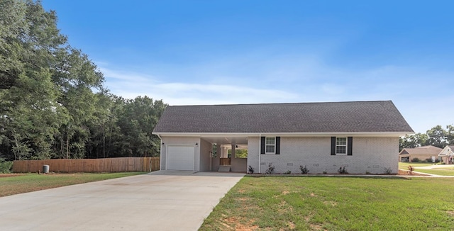 ranch-style home with a carport, a garage, and a front yard