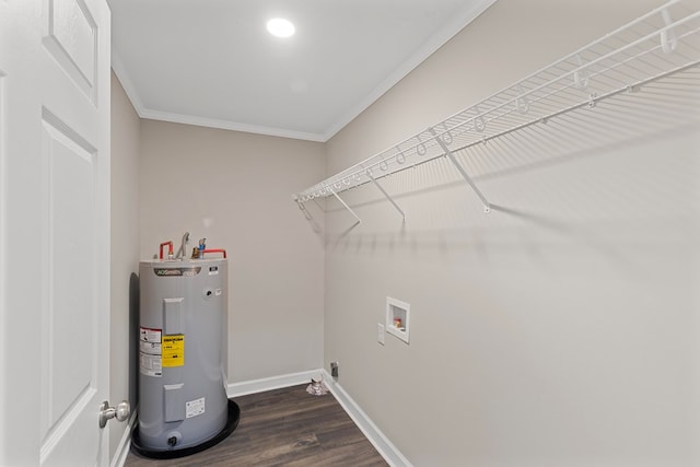 laundry room featuring crown molding, water heater, dark hardwood / wood-style flooring, and washer hookup