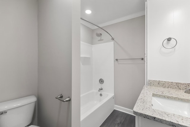 full bathroom featuring vanity, washtub / shower combination, crown molding, toilet, and wood-type flooring