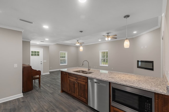 kitchen with ornamental molding, stainless steel appliances, dark wood-type flooring, and sink