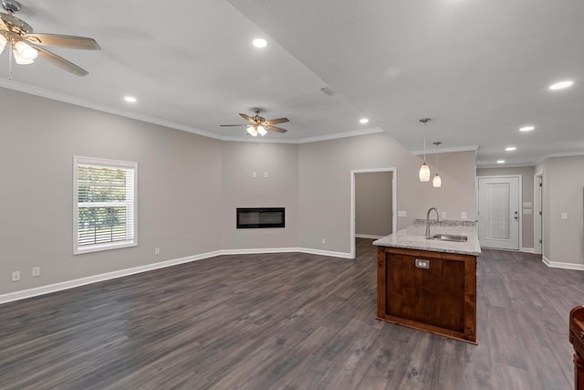 kitchen with ceiling fan, decorative light fixtures, dark hardwood / wood-style floors, and sink