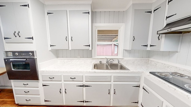 kitchen with white cabinetry and black appliances