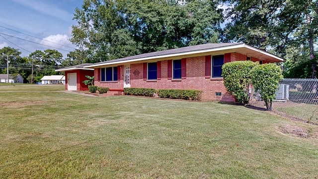 ranch-style home featuring cooling unit, a garage, and a front yard