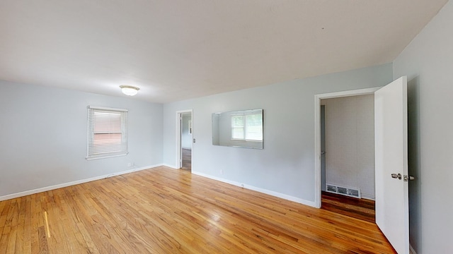 spare room featuring light hardwood / wood-style floors