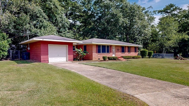 ranch-style home with a front yard and a garage