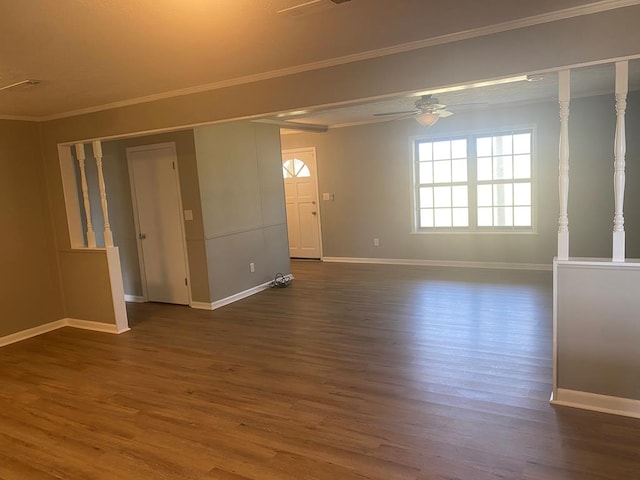 unfurnished room featuring dark hardwood / wood-style floors, ceiling fan, and crown molding