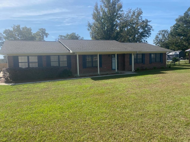 ranch-style home with a front yard