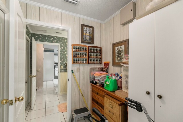 1764 John D Odom Rd, Dothan, AL 36303 - hallway with ornamental molding, light tile patterned floors, a textured ceiling, and wood walls