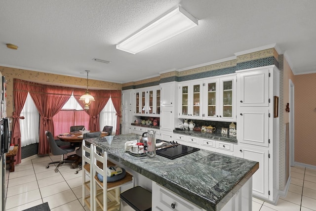 1764 John D Odom Rd, Dothan, AL 36303 - kitchen with wallpapered walls, crown molding, light tile patterned flooring, a textured ceiling, and white cabinets