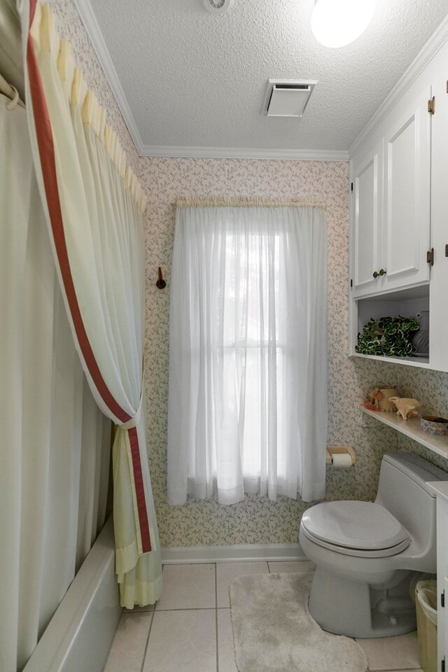 1764 John D Odom Rd, Dothan, AL 36303 - full bathroom featuring crown molding, tile patterned floors, shower / bath combo, and a textured ceiling