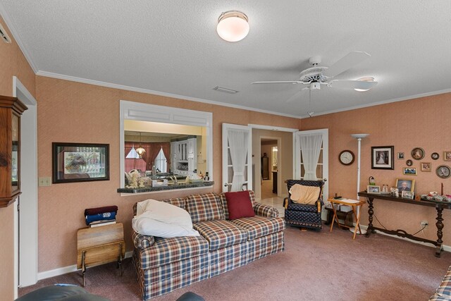1764 John D Odom Rd, Dothan, AL 36303 - carpeted living room with a ceiling fan, a textured ceiling, and ornamental molding