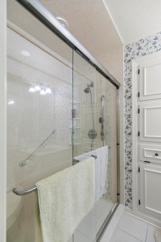 1764 John D Odom Rd, Dothan, AL 36303 - bathroom featuring a stall shower, tile patterned floors, and a textured ceiling