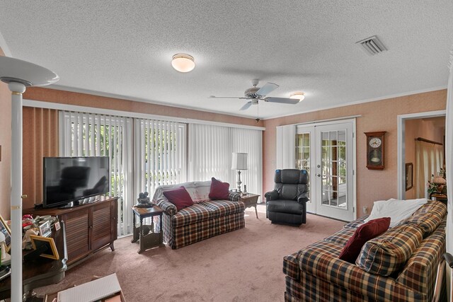1764 John D Odom Rd, Dothan, AL 36303 - carpeted living room with a textured ceiling, a ceiling fan, and french doors