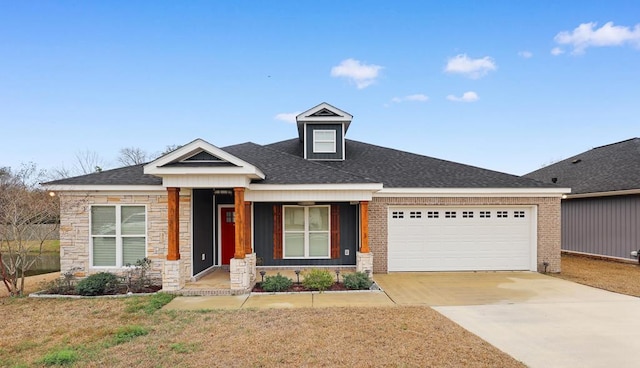 view of front of home featuring a garage, a shingled roof, concrete driveway, stone siding, and a front lawn