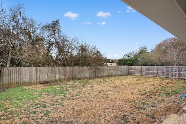 view of yard with a fenced backyard