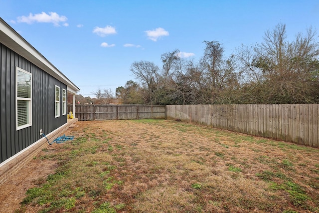 view of yard with a fenced backyard