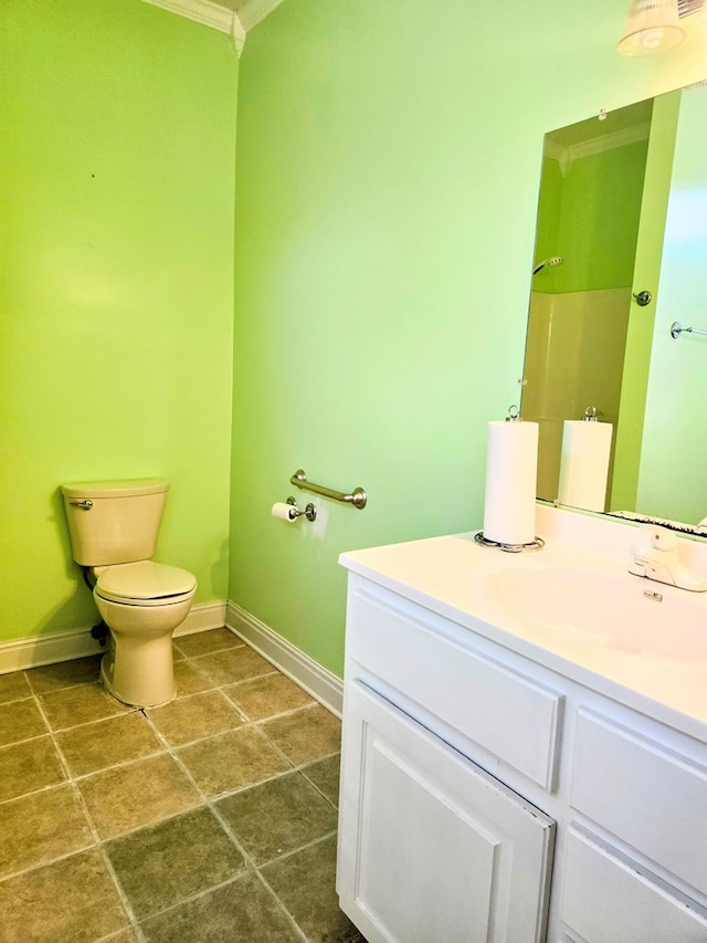 2230 W County Road 16, Headland, AL 36345 - bathroom featuring toilet, vanity, ornamental molding, and baseboards