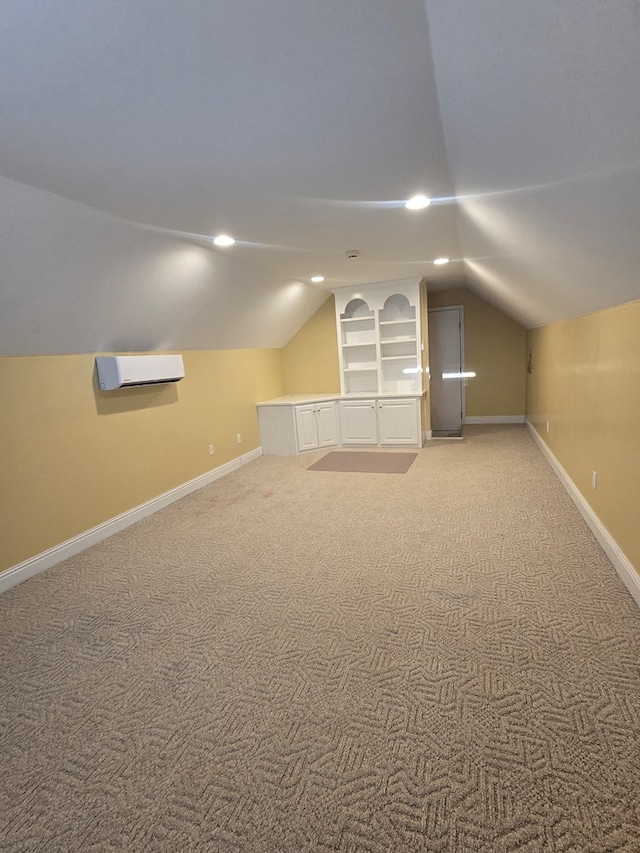 2230 W County Road 16, Headland, AL 36345 - bonus room featuring baseboards, a wall unit AC, light colored carpet, and lofted ceiling