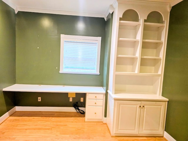 2230 W County Road 16, Headland, AL 36345 - unfurnished office with baseboards, ornamental molding, built in desk, and light wood-style flooring
