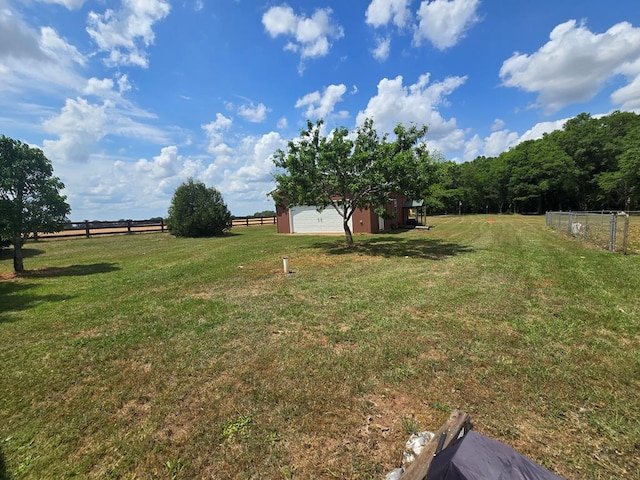 2230 W County Road 16, Headland, AL 36345 - view of yard with an outdoor structure, a rural view, a garage, and fence