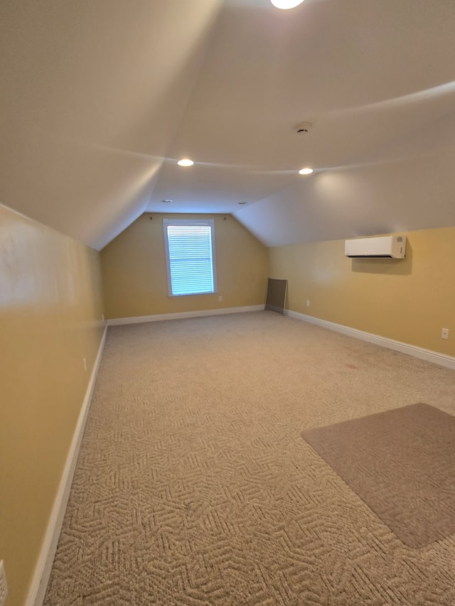 2230 W County Road 16, Headland, AL 36345 - additional living space with recessed lighting, a wall mounted AC, vaulted ceiling, carpet, and baseboards