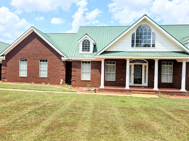 2230 W County Road 16, Headland, AL 36345 - view of front of house featuring brick siding, a front lawn, and metal roof