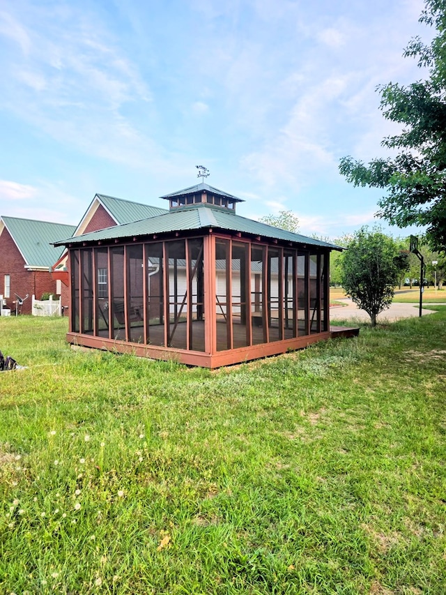 2230 W County Road 16, Headland, AL 36345 - rear view of property featuring metal roof, a yard, and a sunroom