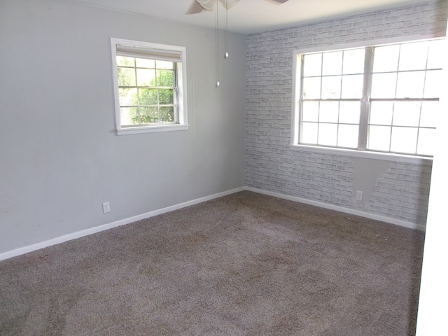5559 N County Road 69, Newton, AL 36352 - carpeted empty room with a ceiling fan and healthy amount of natural light