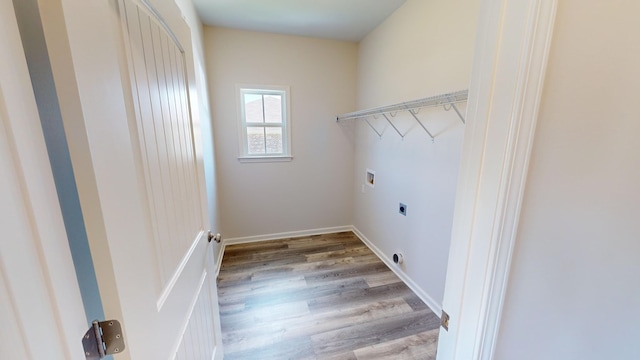 clothes washing area featuring hookup for an electric dryer, hookup for a washing machine, and hardwood / wood-style flooring