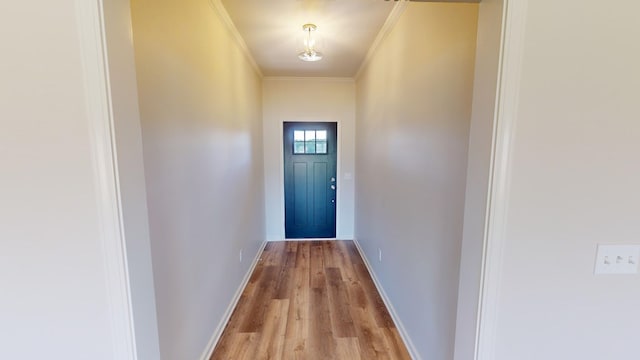 entryway featuring light hardwood / wood-style flooring and ornamental molding