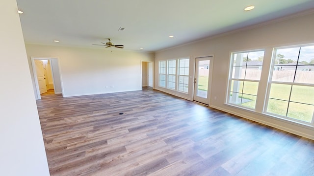 unfurnished room with ceiling fan, light hardwood / wood-style flooring, and ornamental molding