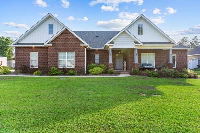 213 Archer Trl, Enterprise, AL 36351 - view of front of house featuring brick siding, board and batten siding, and a front yard