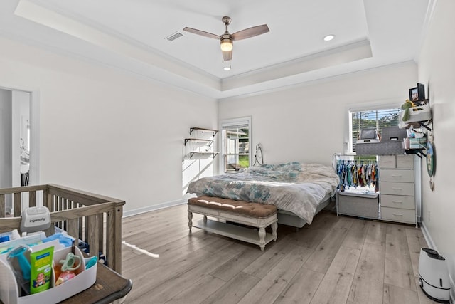 213 Archer Trl, Enterprise, AL 36351 - bedroom featuring visible vents, crown molding, light wood-style floors, recessed lighting, and a raised ceiling