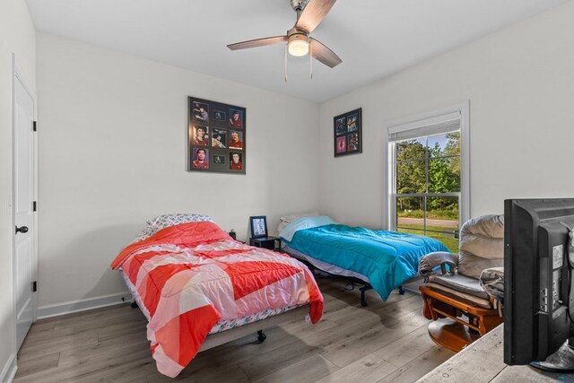 213 Archer Trl, Enterprise, AL 36351 - bedroom featuring baseboards, a ceiling fan, and wood finished floors