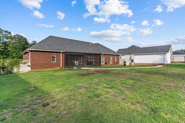 213 Archer Trl, Enterprise, AL 36351 - back of property featuring fence, a yard, a sunroom, and brick siding