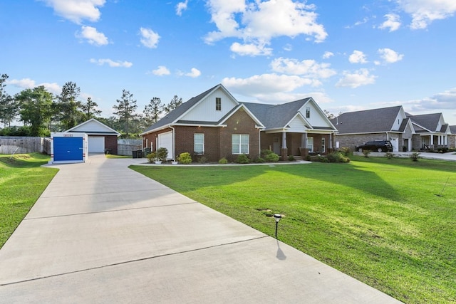 213 Archer Trl, Enterprise, AL 36351 - view of front of house featuring a detached garage, a front lawn, and brick siding