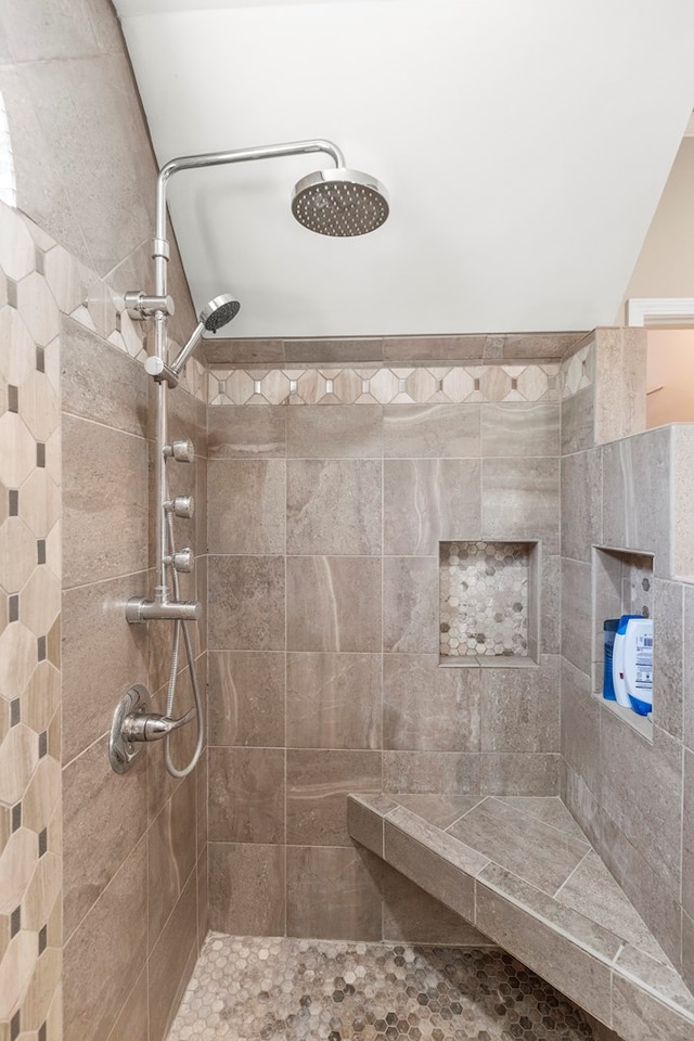 bathroom with tiled shower