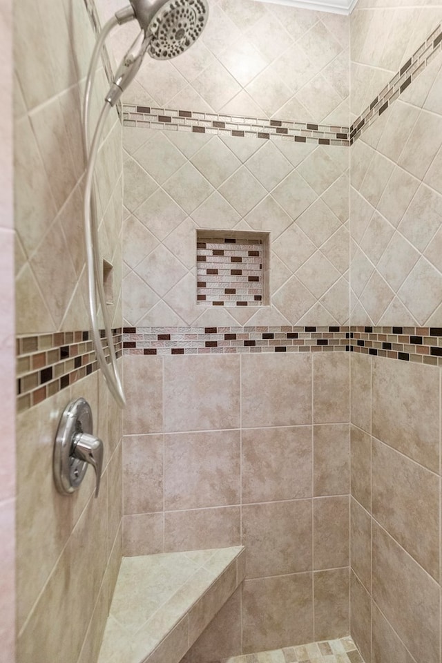 bathroom featuring tiled shower