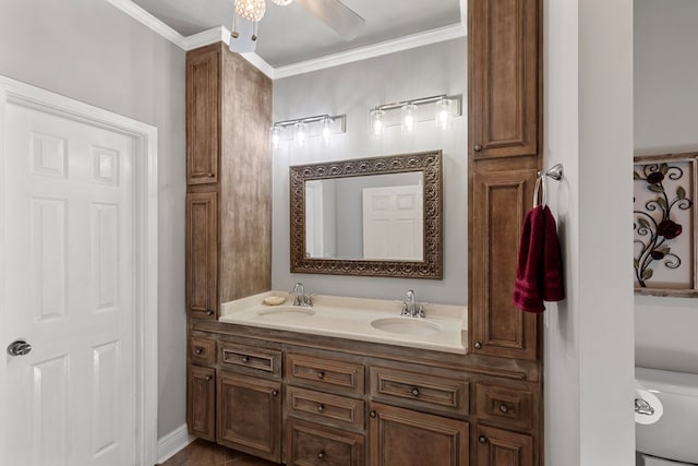 bathroom featuring vanity, ornamental molding, and toilet