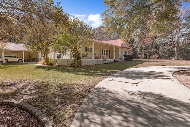 view of front of house featuring covered porch and a front lawn