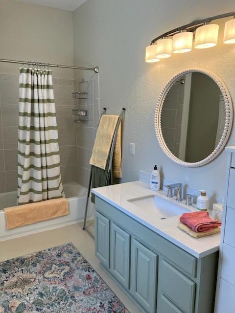 full bathroom featuring shower / tub combo and vanity