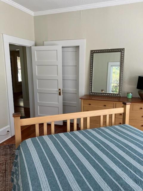 bedroom with ornamental molding