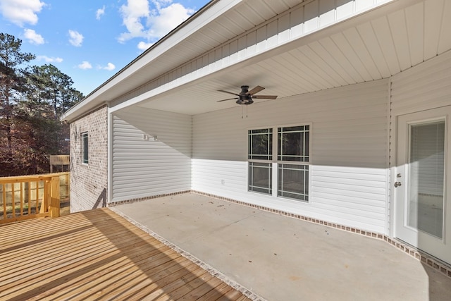 deck featuring ceiling fan and a patio area