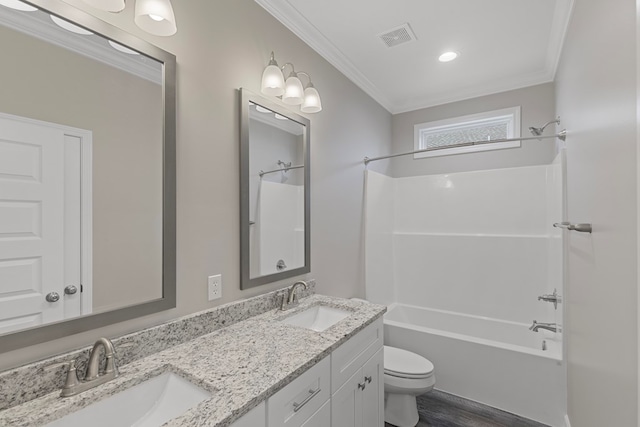 full bathroom featuring vanity, bathing tub / shower combination, crown molding, wood-type flooring, and toilet