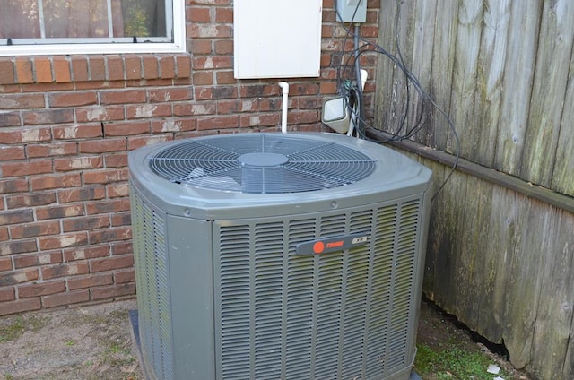 124 Whitney Ave, Enterprise, AL 36330 - exterior view of a cooling unit and brick siding