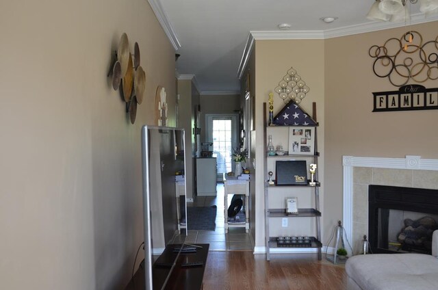124 Whitney Ave, Enterprise, AL 36330 - living area with crown molding, a tile fireplace, and dark wood finished floors