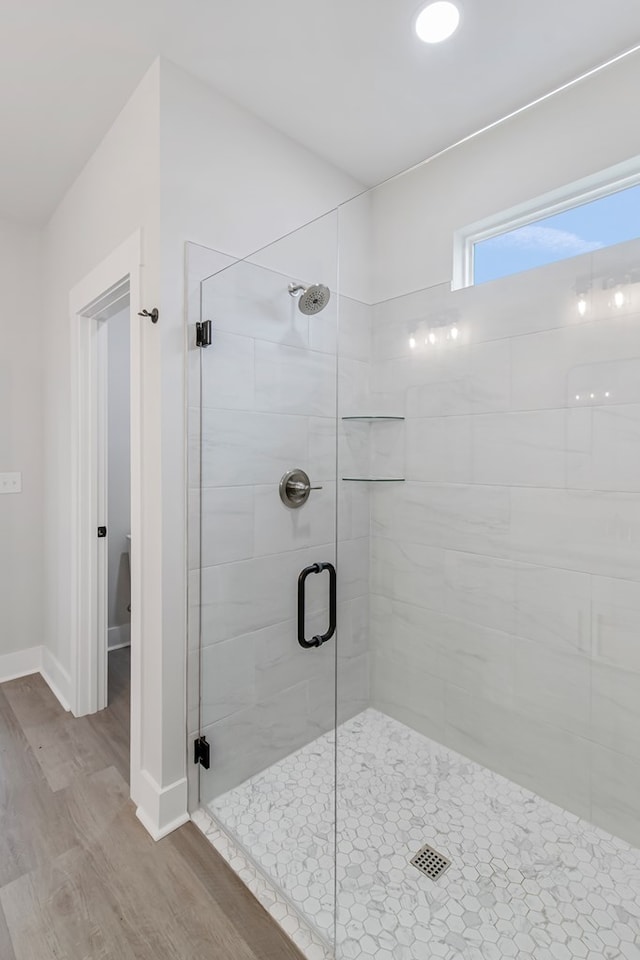 1919 Silcox Rd, Ashford, AL 36312 - full bathroom featuring a shower stall, baseboards, and wood finished floors