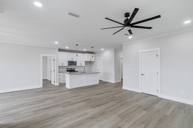 1919 Silcox Rd, Ashford, AL 36312 - unfurnished living room with crown molding, a sink, visible vents, ceiling fan, and recessed lighting